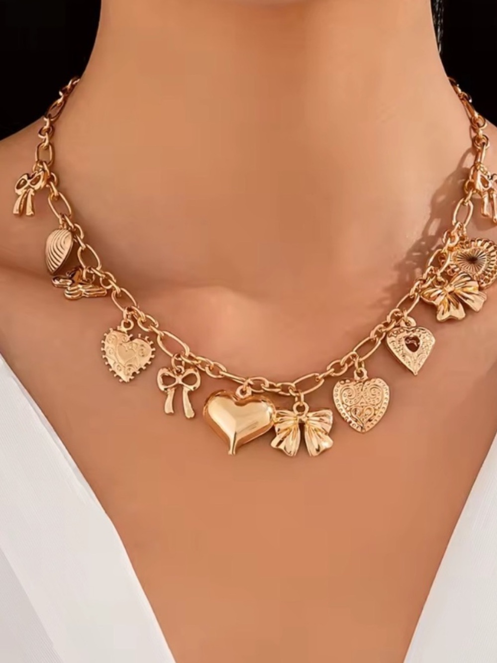 Anthropologie Gold Heart & Bow Charm Necklace